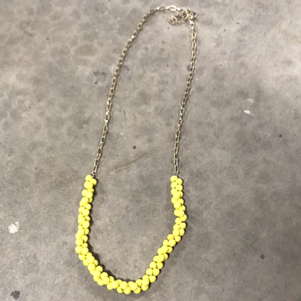 Yellow beaded necklace with metal chain links